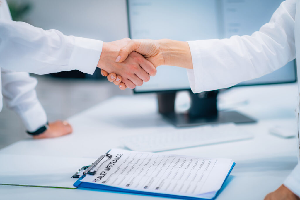 Handshake After Signing Health Insurance Form