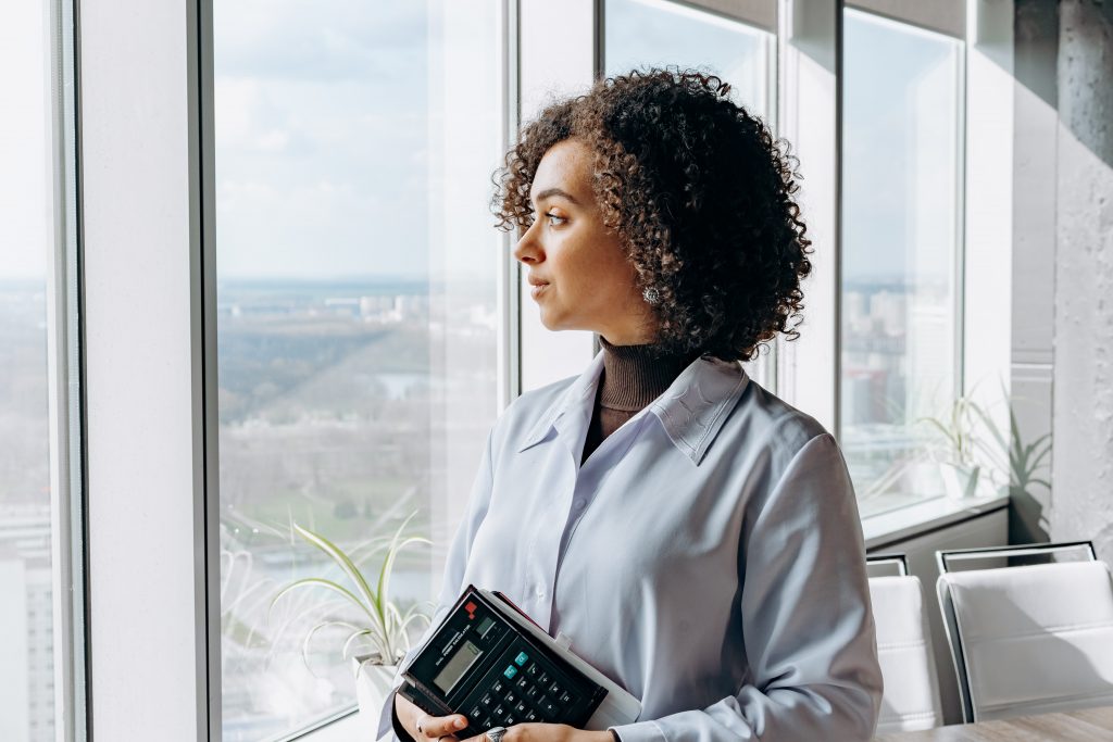 A woman thinking about ancillary insurance